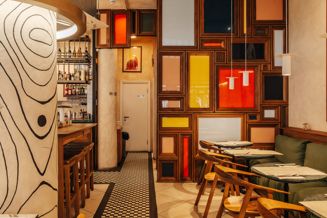 The bar and dining room at Fiena, King's Cross, with its framed-panel wall and mosaic floor